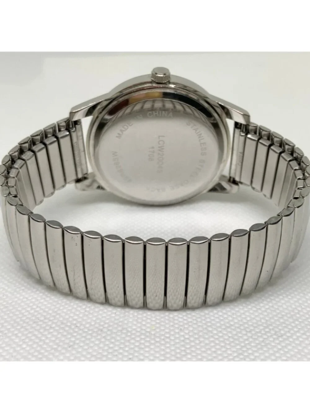 L&Co silver tone men’s watch 40mm quartz analog stretch band 7.5” running